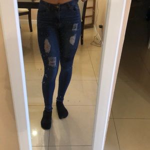 Ripped blue jeans with patches